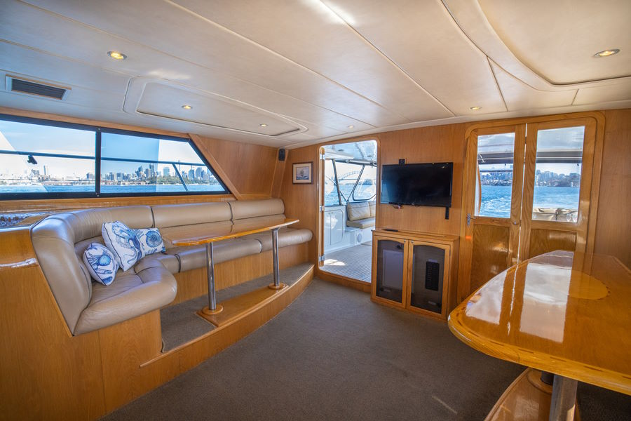 Indoor saloon with kauri pine and cream leather seating